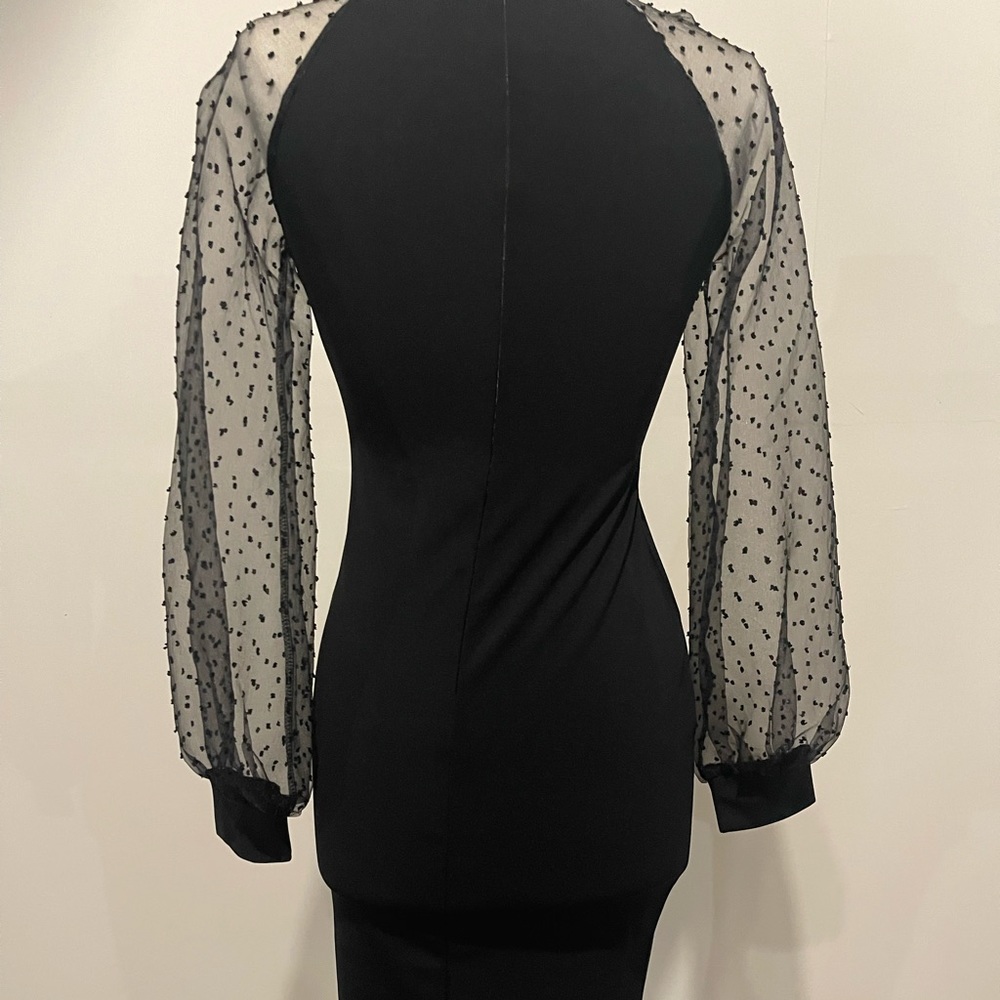 Black cocktail dress w sheer long sleeves.  Size medium